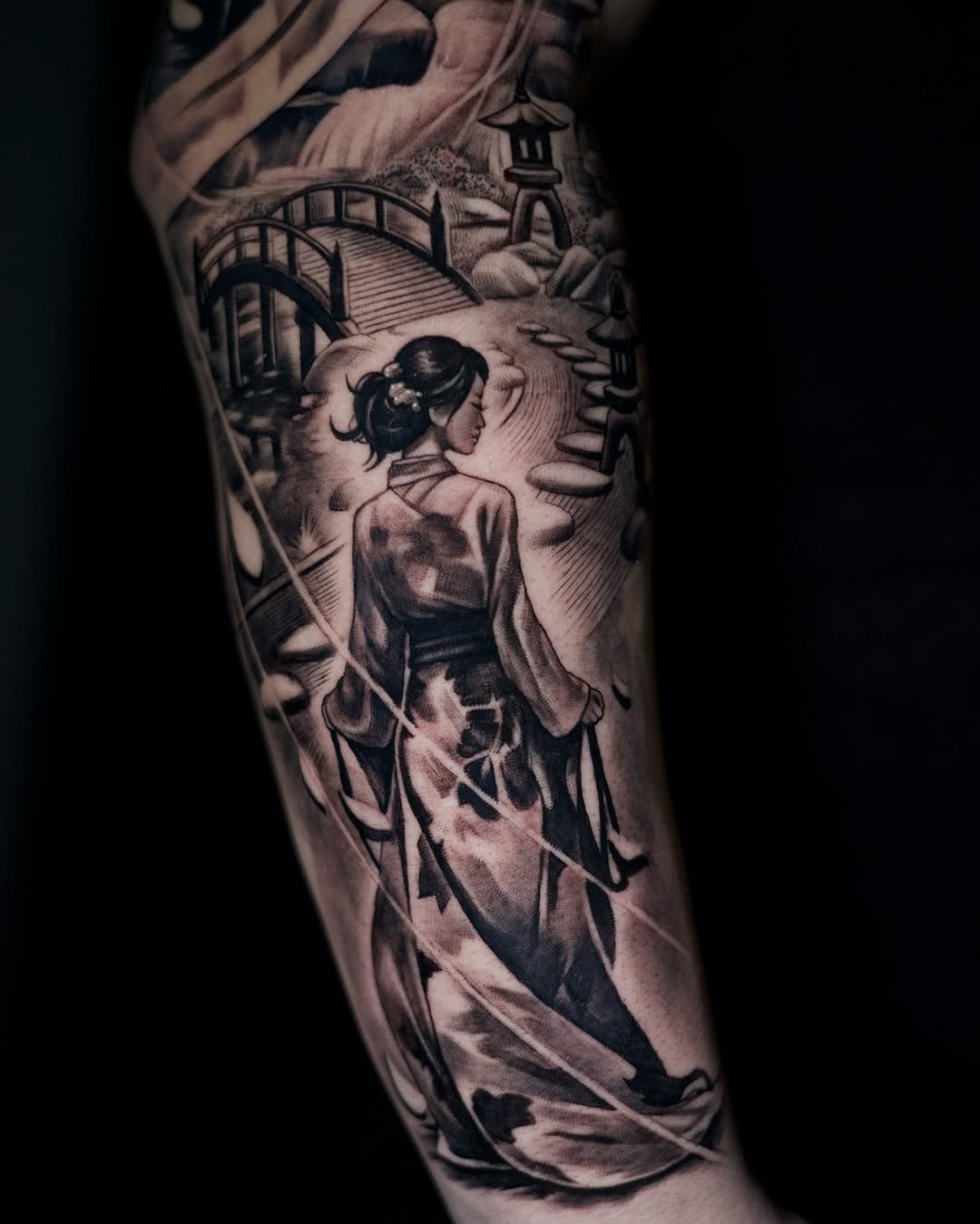 Completed samurai and geisha tattoo showcasing intricate black and grey work by Adrian Idso