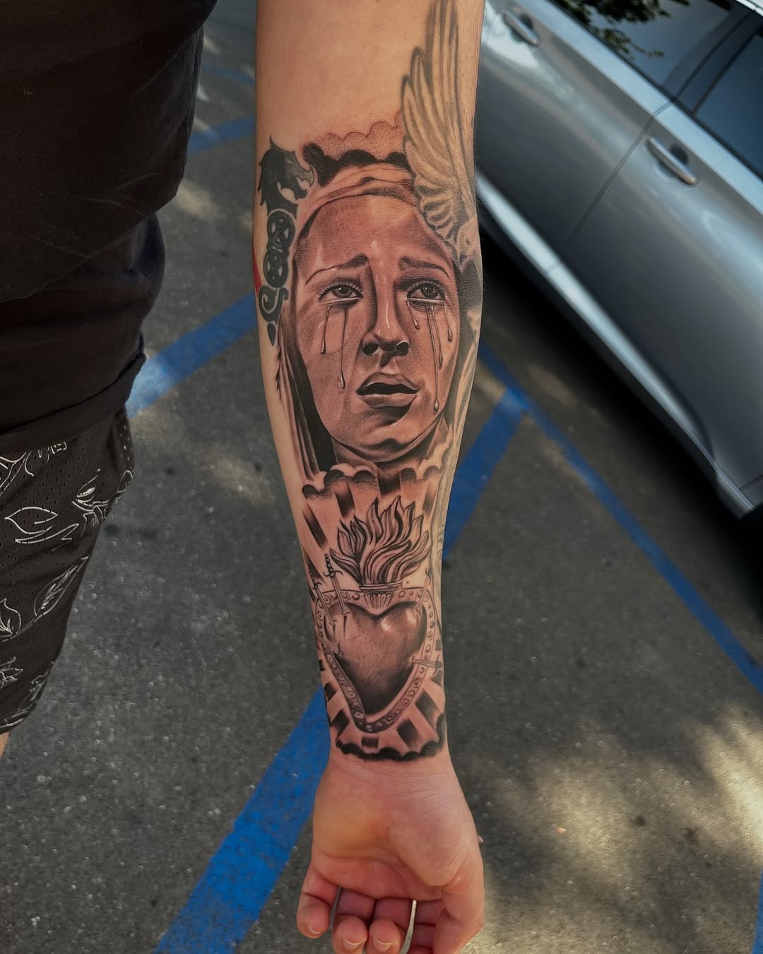 Completed sacred heart filler tattoo by Jesus Bernal at Broadway Dept. Sacramento