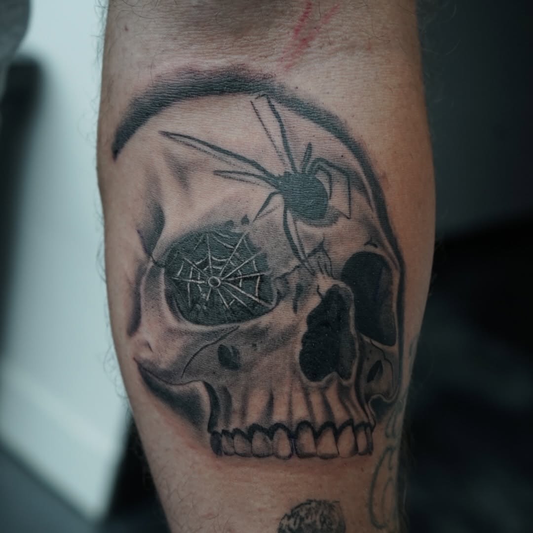 Completed skull and spider tattoo on client by Jesus Bernal at Broadway Dept. Sacramento