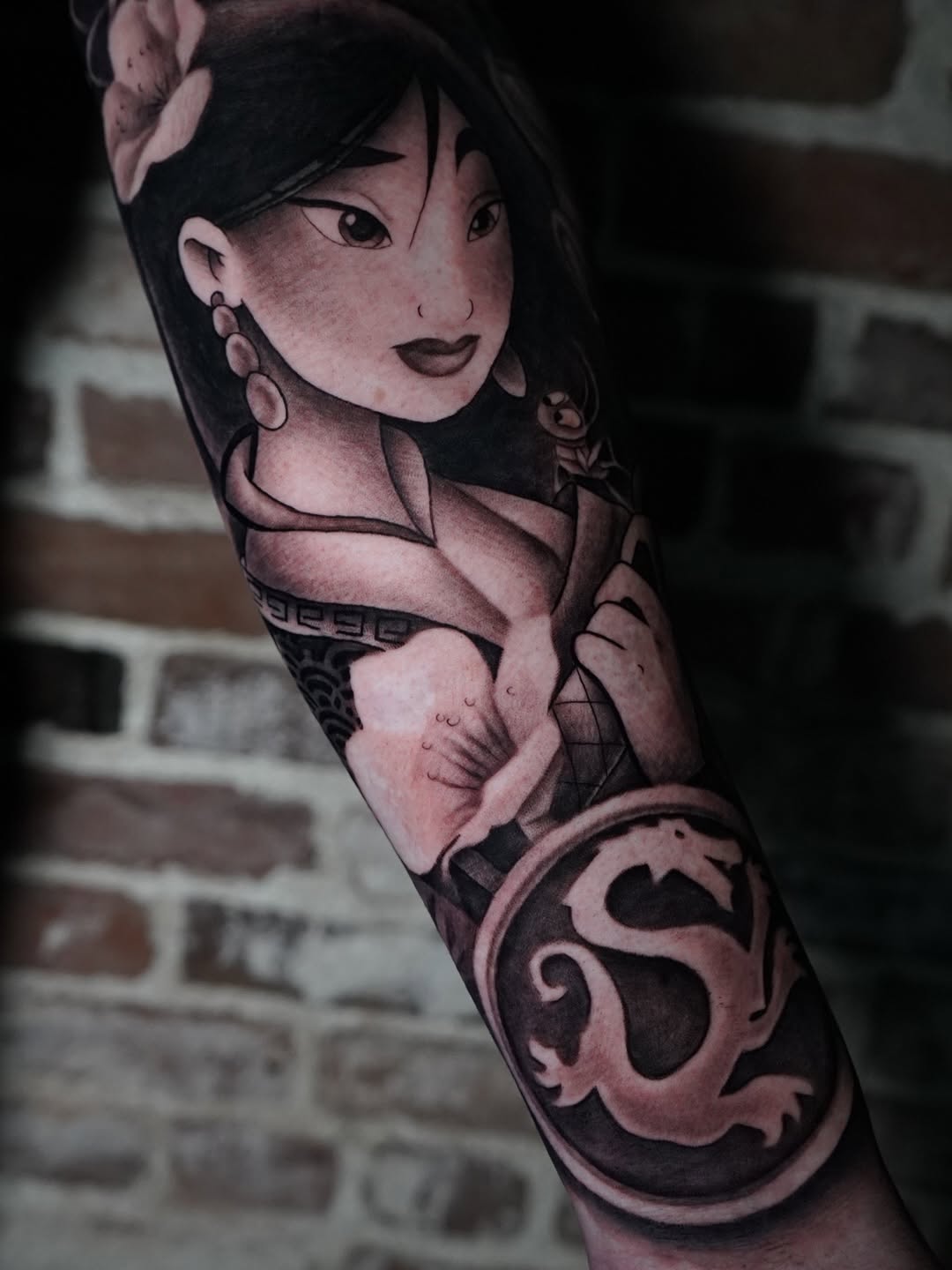 Complete Mulan character tattoo with vibrant flower design by Charleigh Rae at Midtown Sacramento