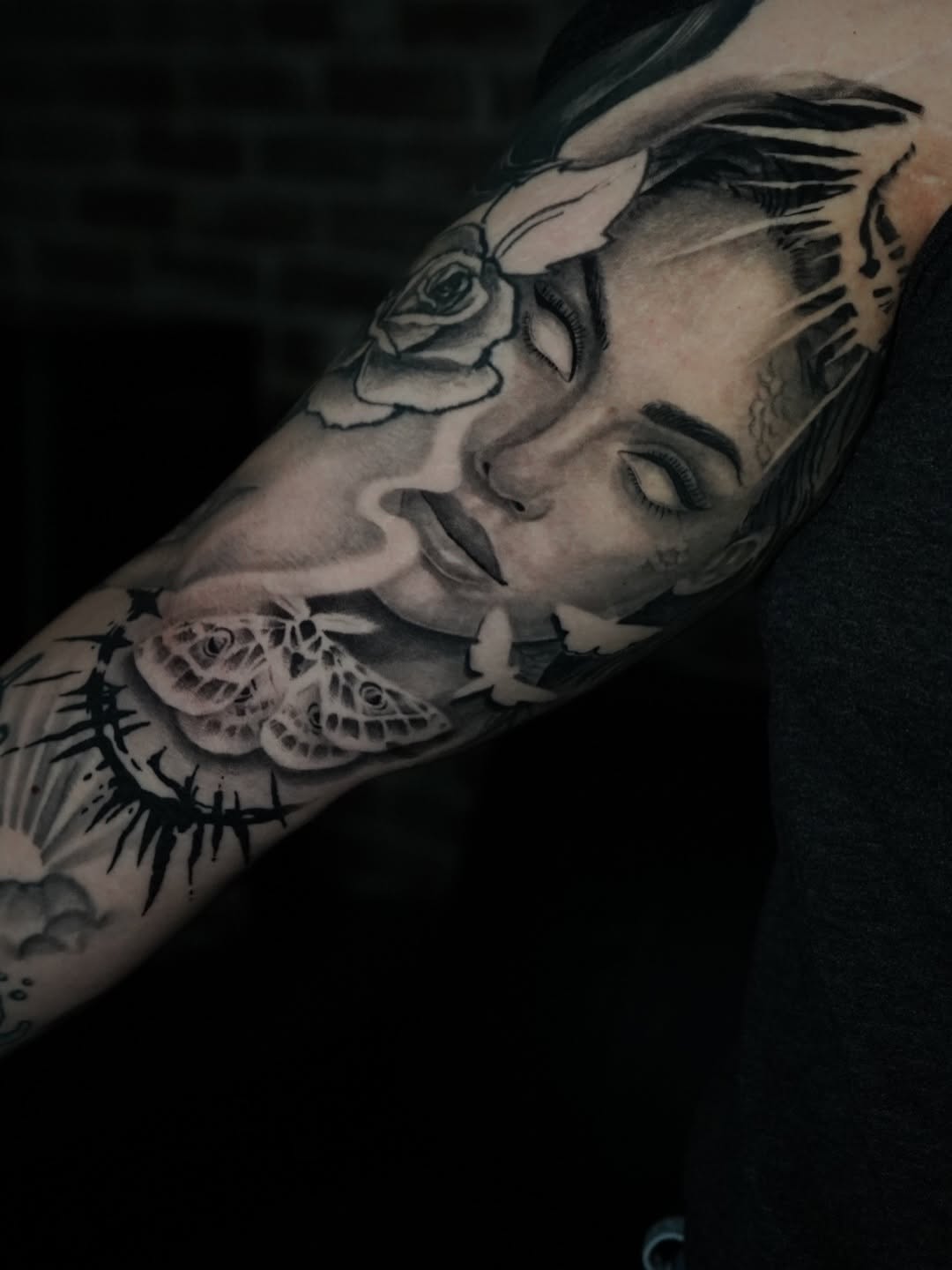 Close-up detail of gothic siren tattoo featuring dark aesthetic elements by Charleigh Rae