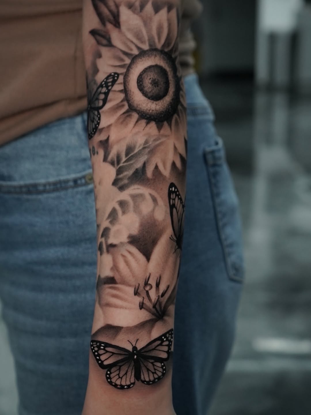 Detail view of butterfly tattoo artwork by Charleigh Rae at Broadway Dept. Sacramento