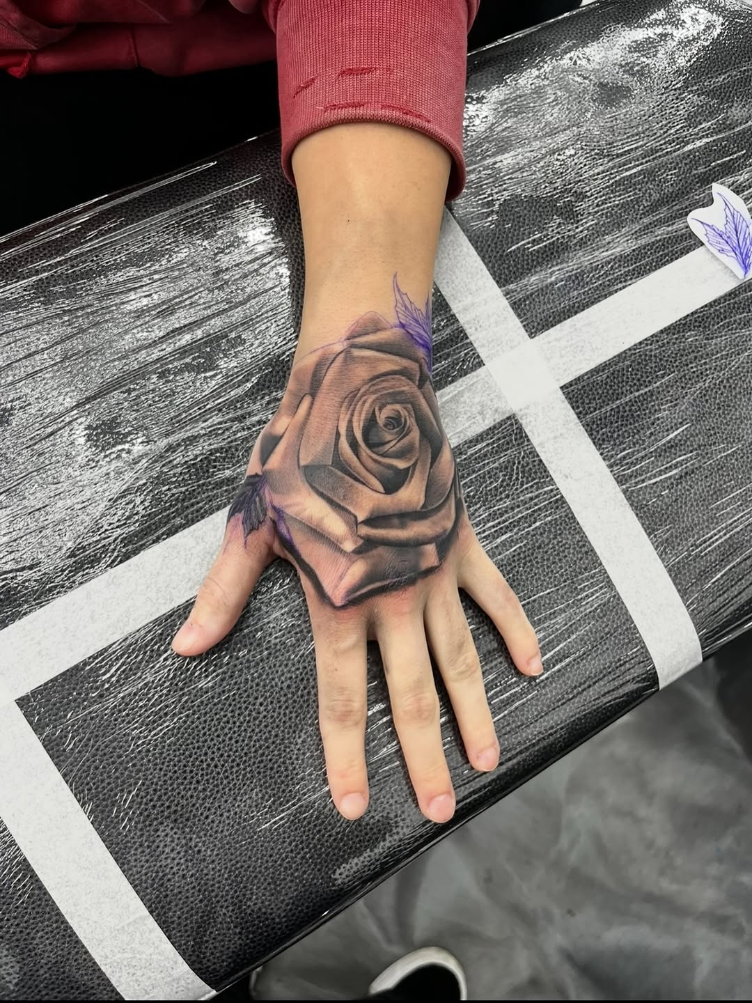 Finished rose tattoo by Jesus Bernal showcasing shading and detail at Broadway Dept. Midtown Sacramento