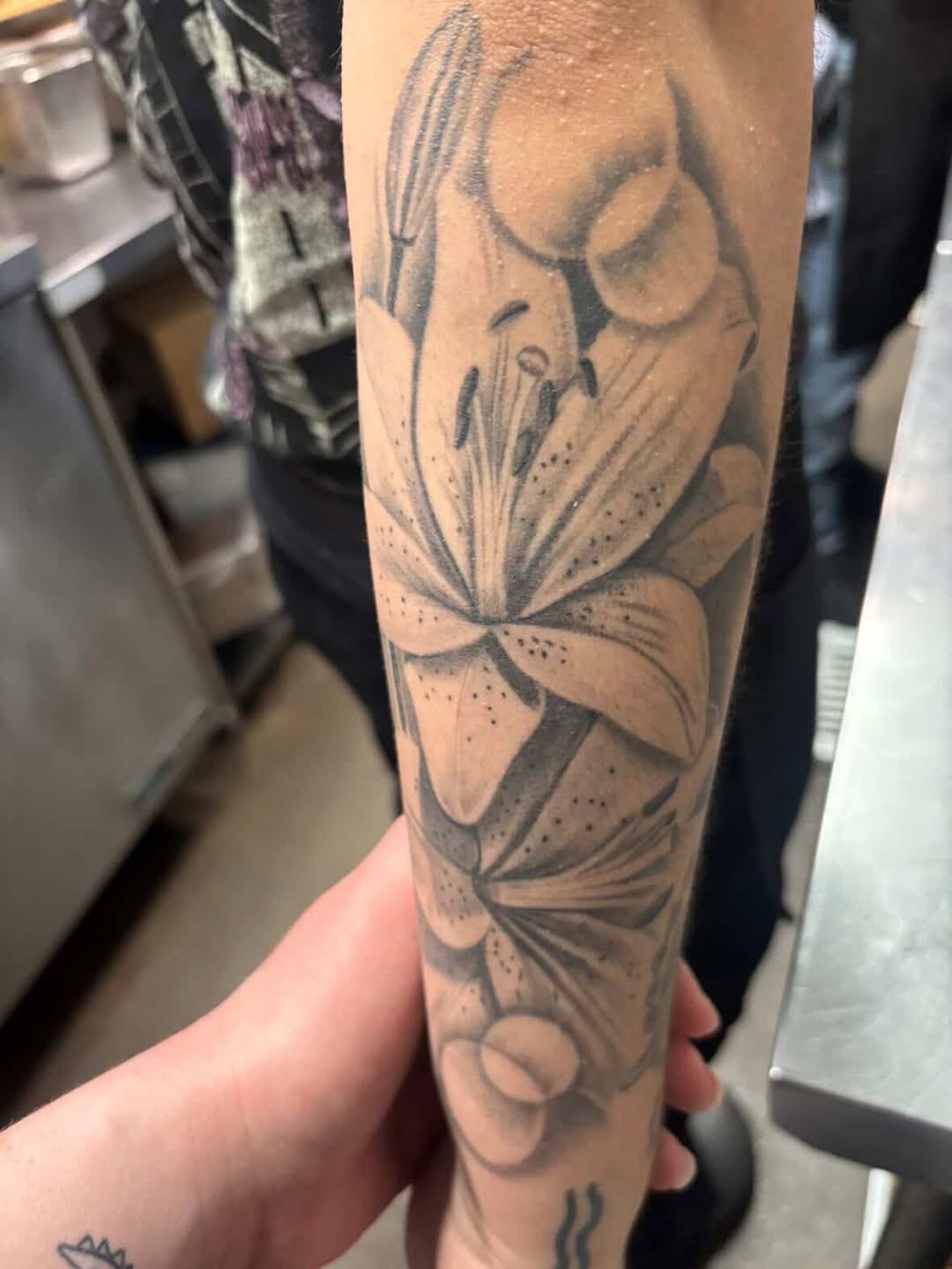 Completed lily tattoo by Jesus Bernal at Broadway Dept. Midtown Sacramento