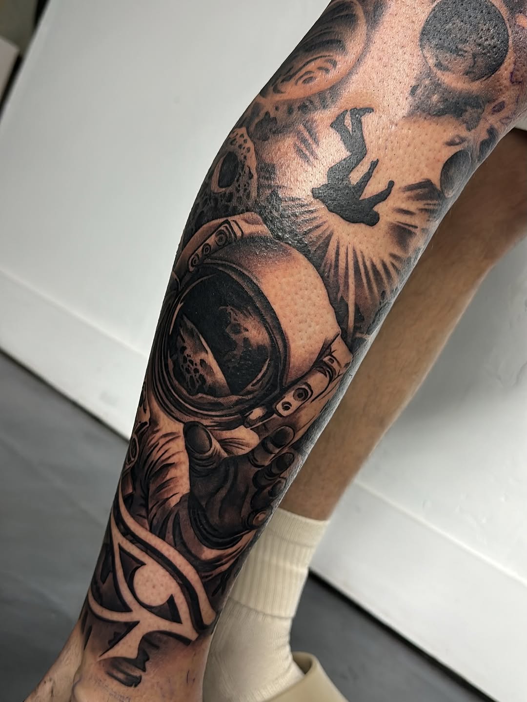 Designer quality leg sleeve tattoo by Jack Stralen at Broadway Dept