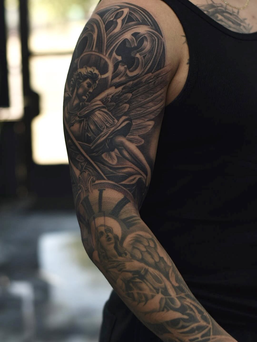 Archangel sleeve tattoo in progress showing placement and scale at Broadway Dept. Sacramento