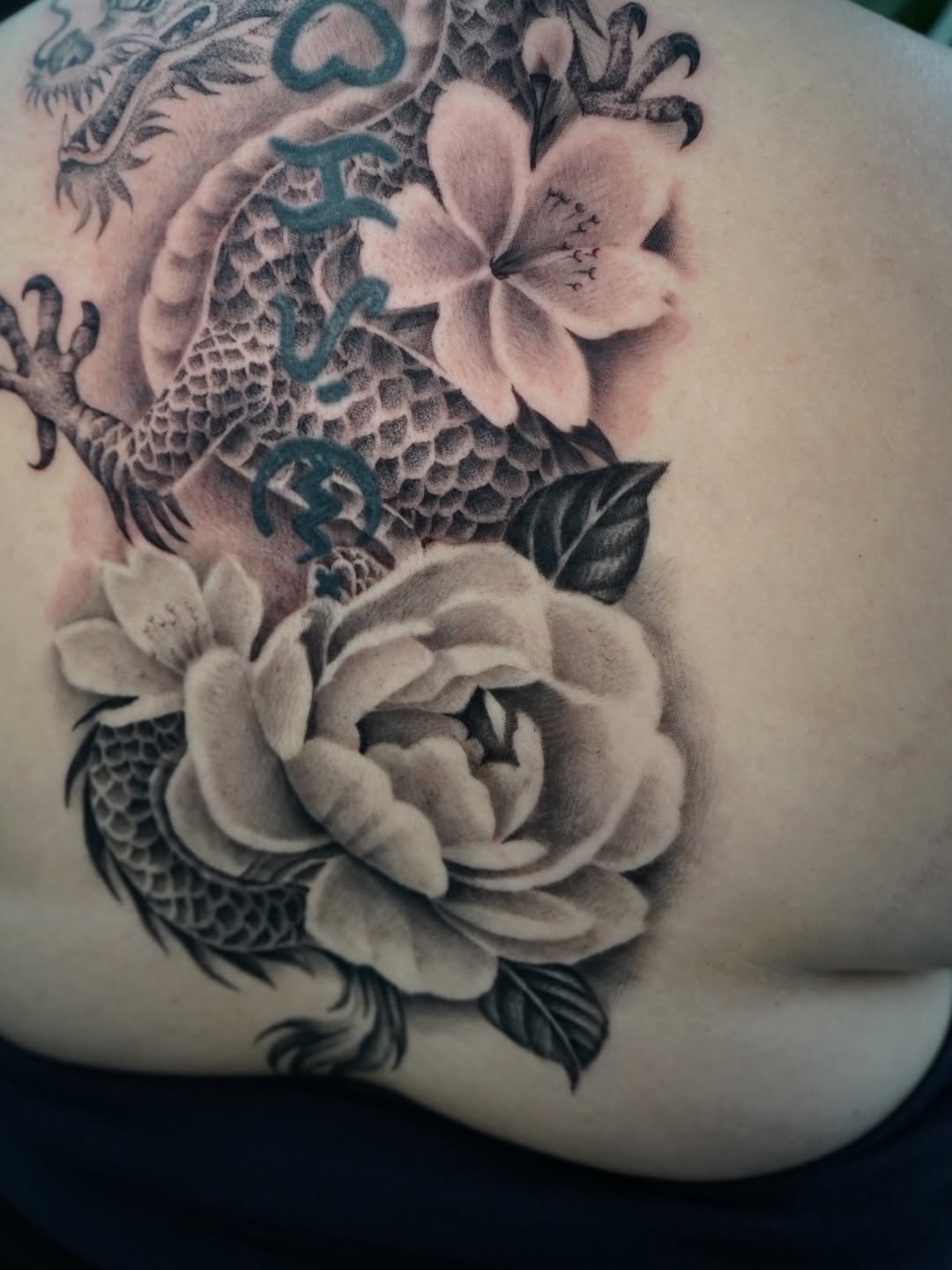 Completed dragon back piece tattoo on client at Broadway Dept. Midtown Sacramento