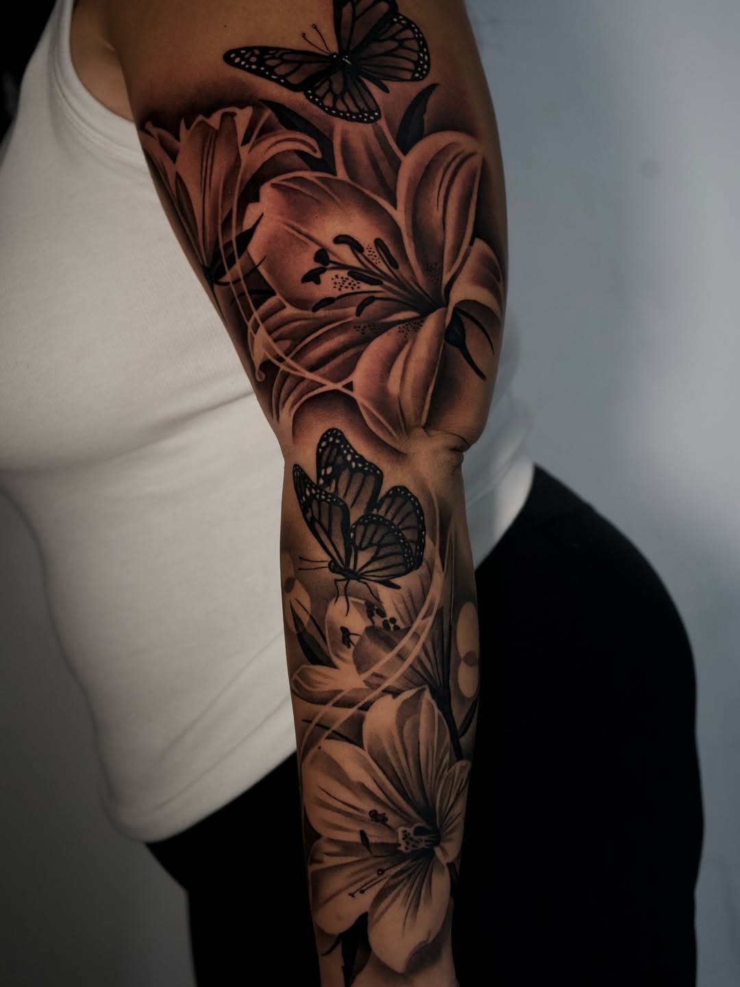 Flower and butterfly tattoo artwork at Broadway Dept. tattoo shop Sacramento