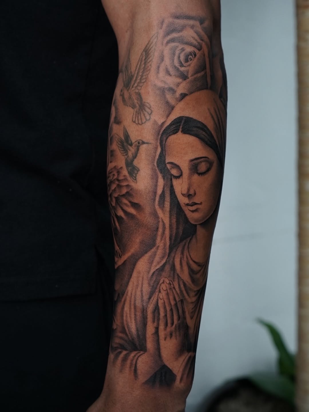 Close-up of meaningful Virgin Mary religious tattoo design