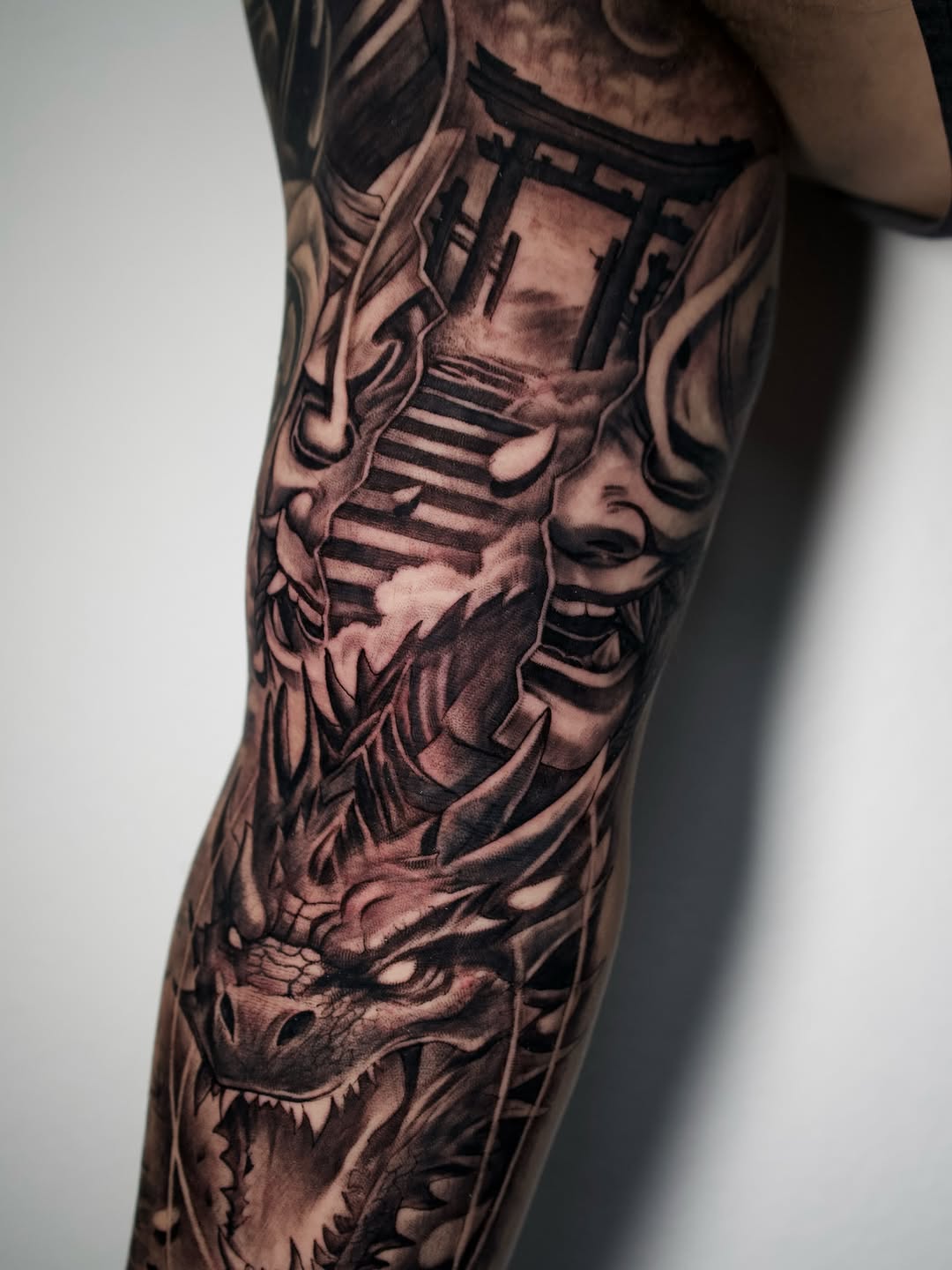 Final arm sleeve tattoo session showing completed design at Broadway Dept. Midtown