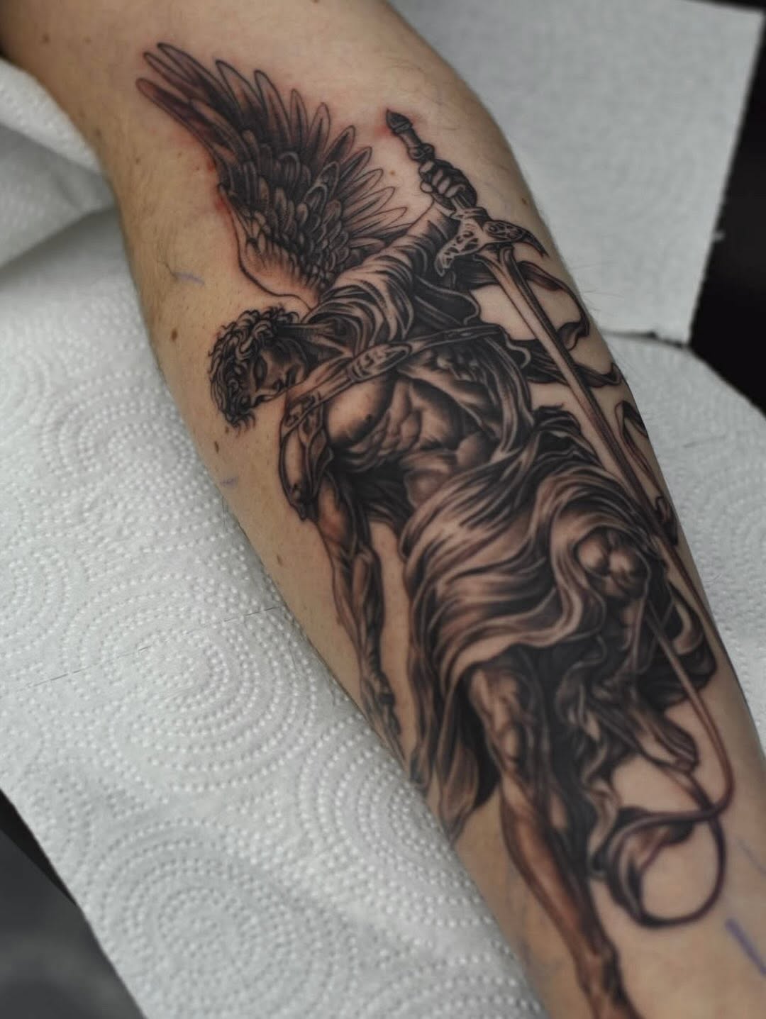 Saint Michael the Archangel religious tattoo design with bold lines at Broadway Dept Sacramento