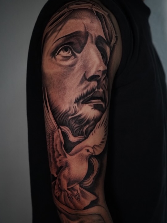 Detail view of custom outer sleeve tattoo design at Broadway Dept. Sacramento