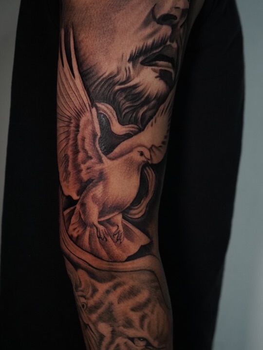 Finished outer sleeve tattoo on client at Broadway Dept. tattoo shop on 21st Street Sacramento