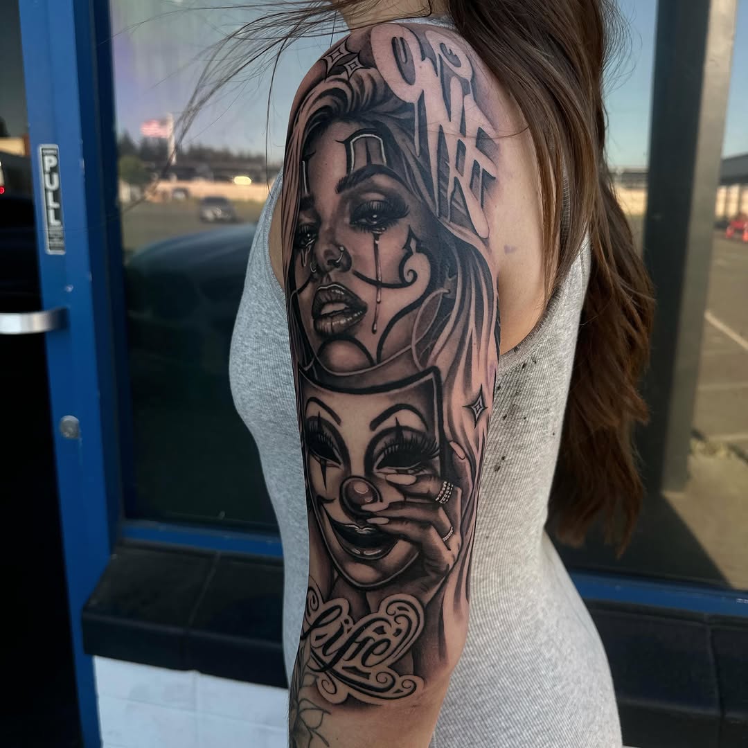 Close-up detail of Smile Now Cry Later tattoo by Bella Gomez at Broadway Dept. Midtown Sacramento