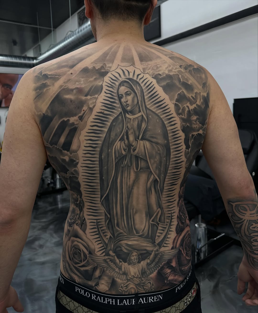 Completed Virgin Mary backpiece tattoo after nine sessions at Broadway Dept. Sacramento