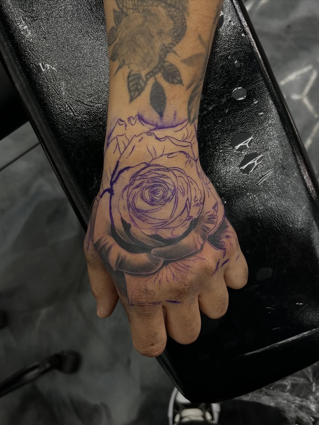 Classic hand rose tattoo at Broadway Dept. Midtown Sacramento