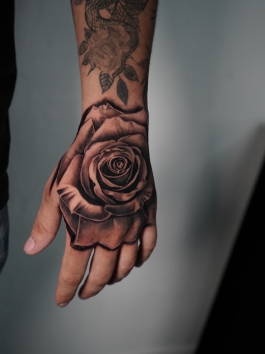 Hand rose tattoo design at Broadway Dept. Midtown Sacramento