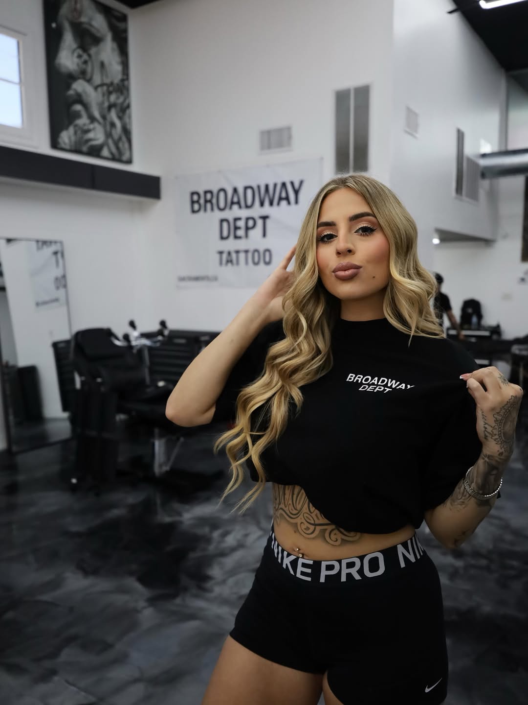 Isabella BG, tattoo artist at Broadway Dept. Sacramento, posing for portrait