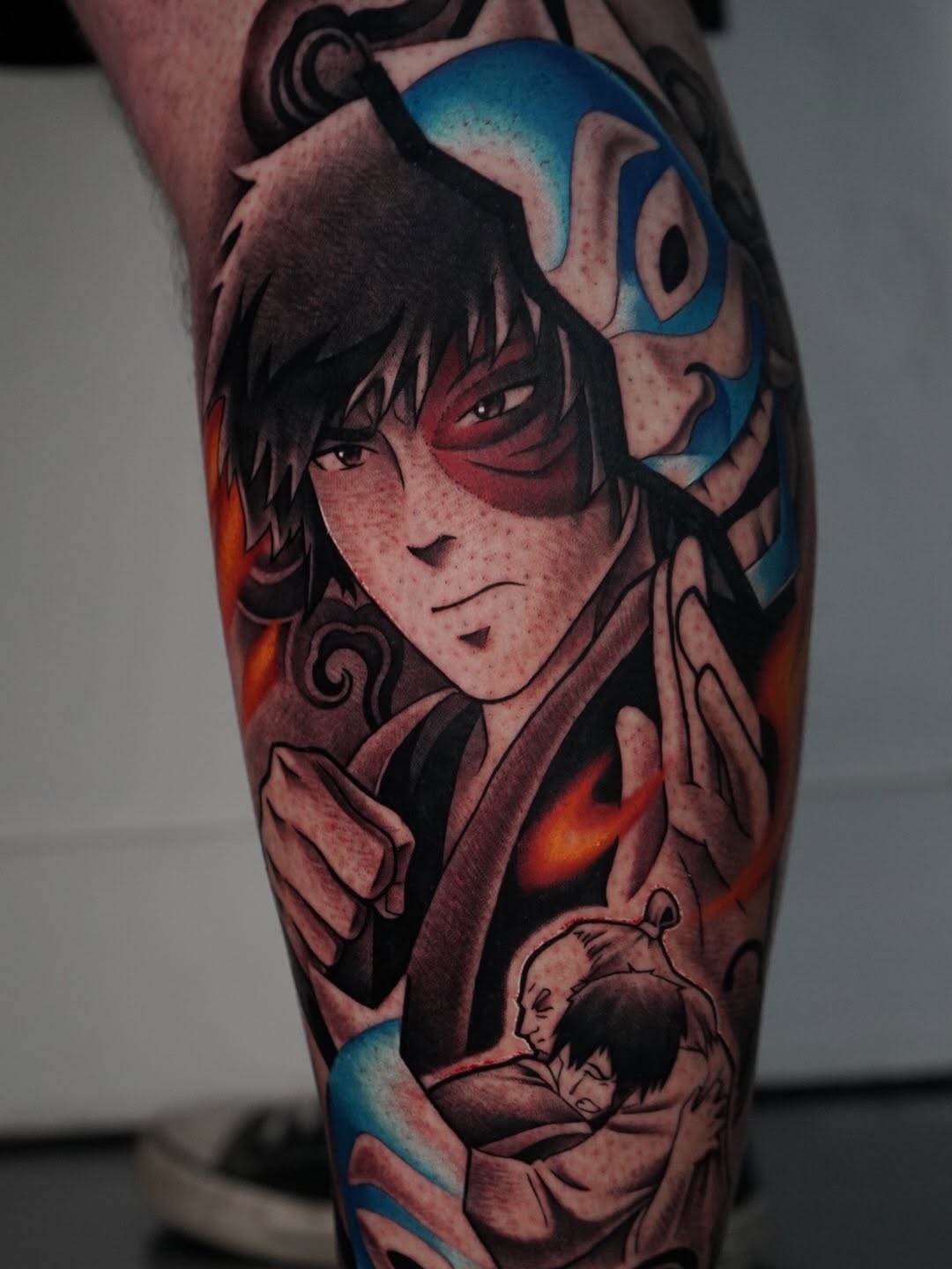 Close-up detail of Zuko Avatar tattoo showing facial features and fire bending elements by Crystal Mercedes