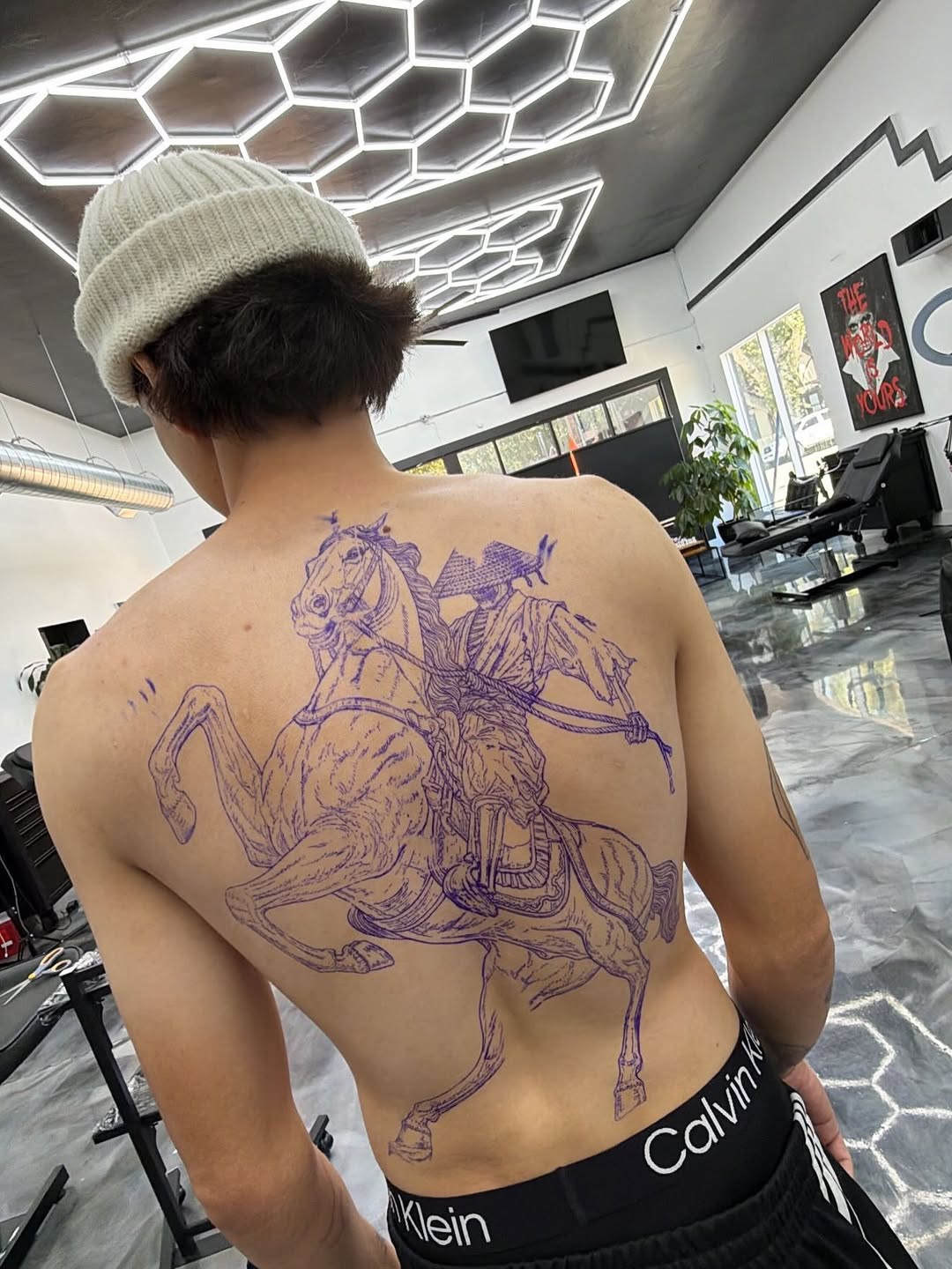 Tattoo artist completing detailed work during consecutive sessions at Broadway Dept. Midtown