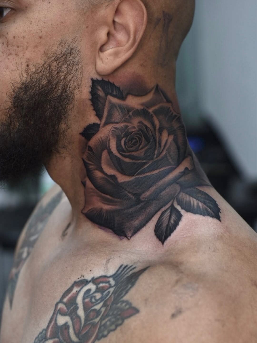 Classic rose tattoo design showcasing traditional linework and shading by Broadway Dept. Sacramento.