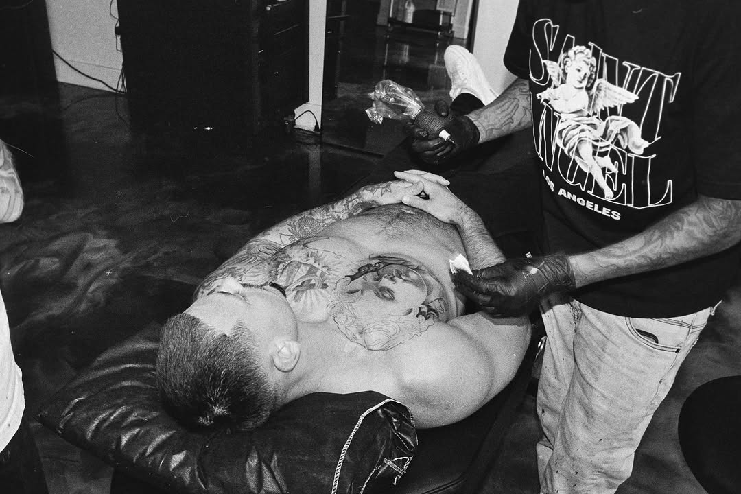 Talented tattoo artist at work creating custom design at Broadway Dept. in Sacramento.
