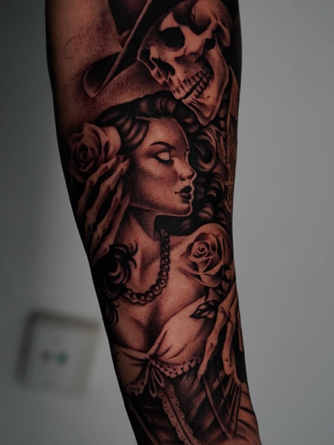 Close-up of rose tattoo with black ink detail by Broadway Dept. artist