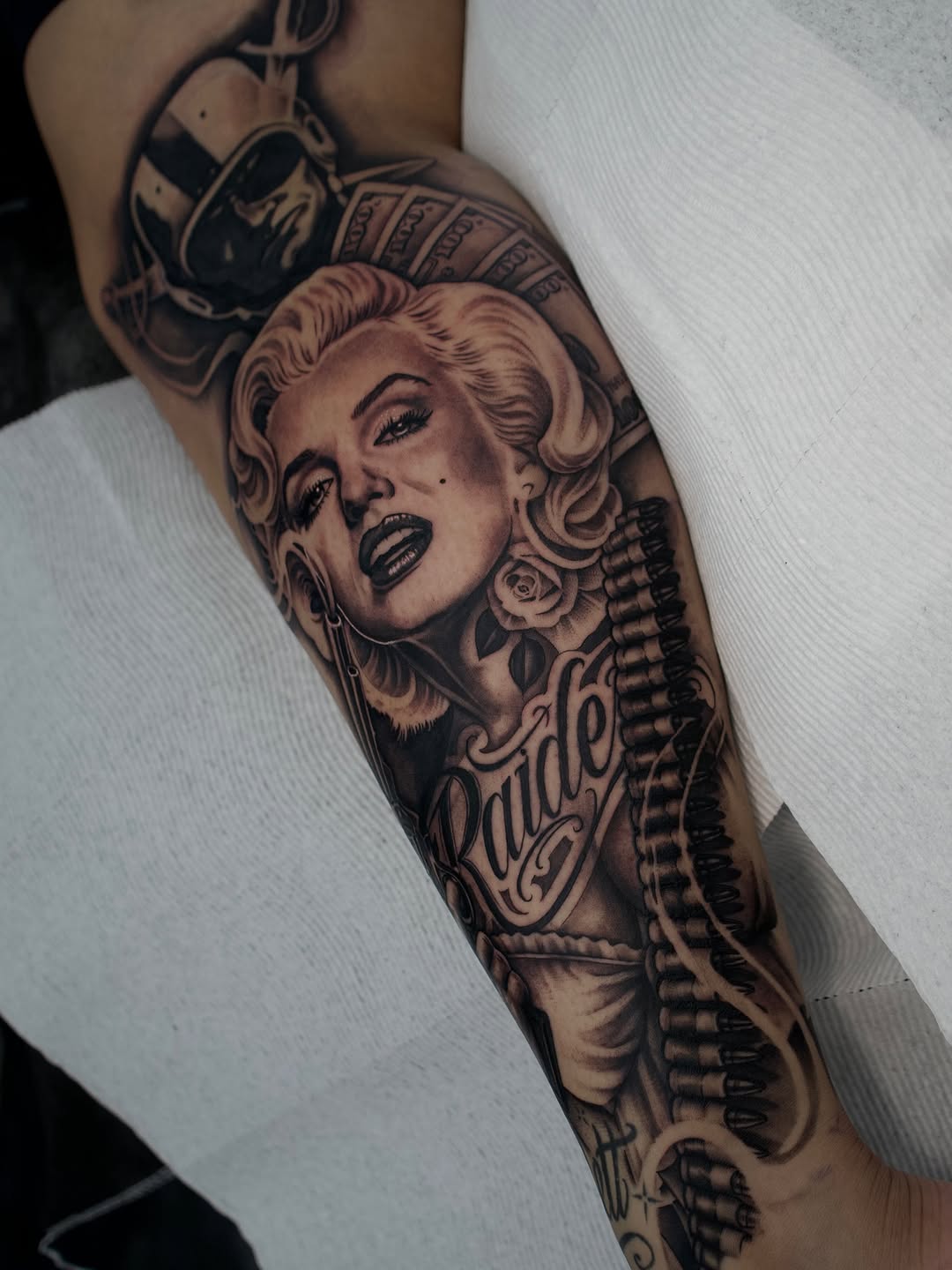 Close-up detail of Marilyn Raiderette tattoo design by Bella Gomez in Midtown Sacramento
