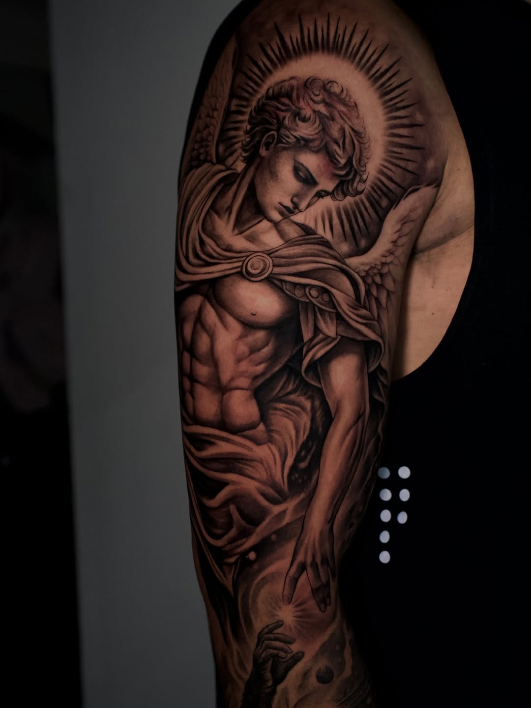 Fresh angel and ape design on upper arm by Broadway Dept in Midtown Sacramento