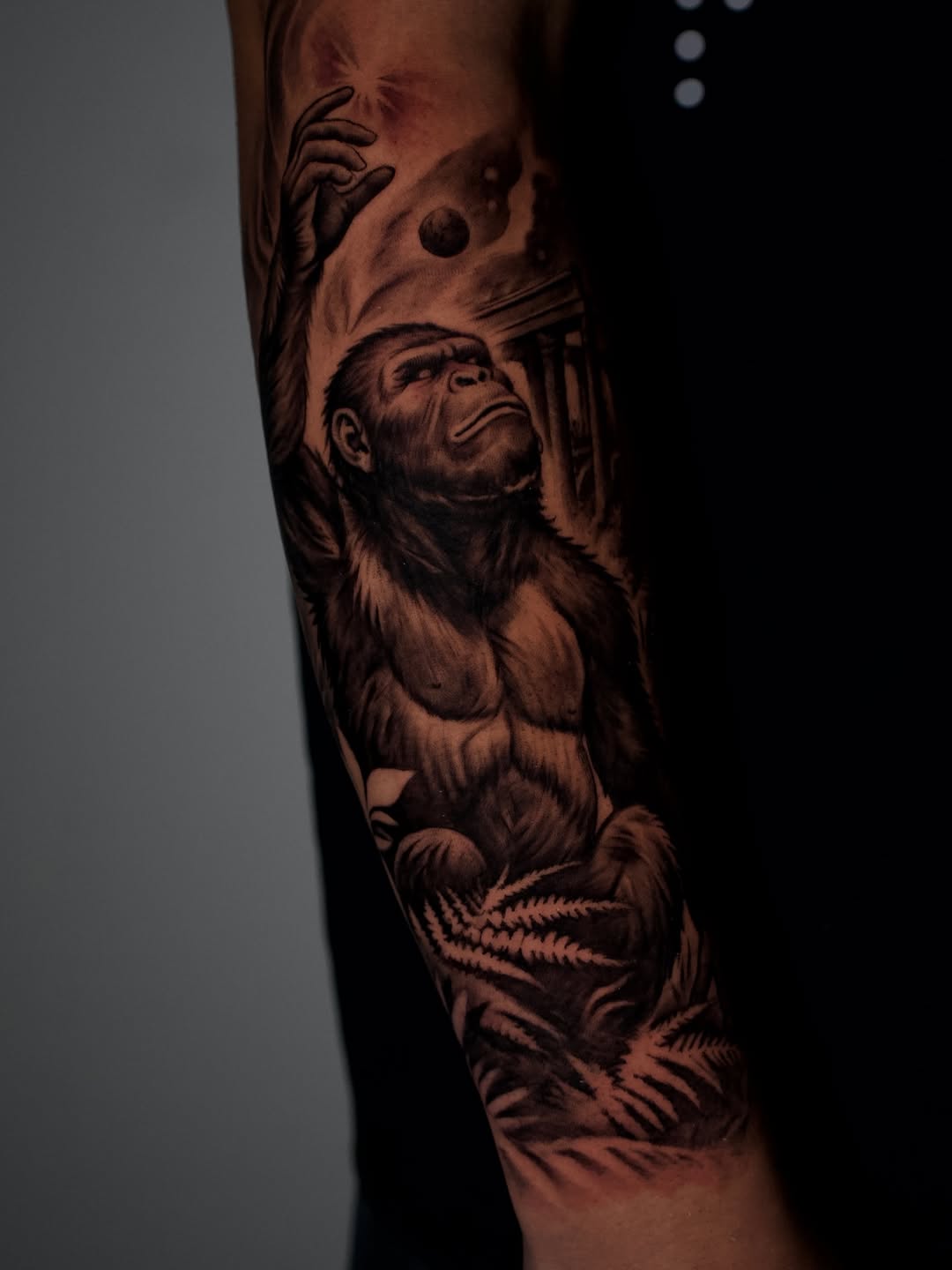 Completed two-day angel and ape tattoo showing both healed and fresh sections at Broadway Dept Sacramento