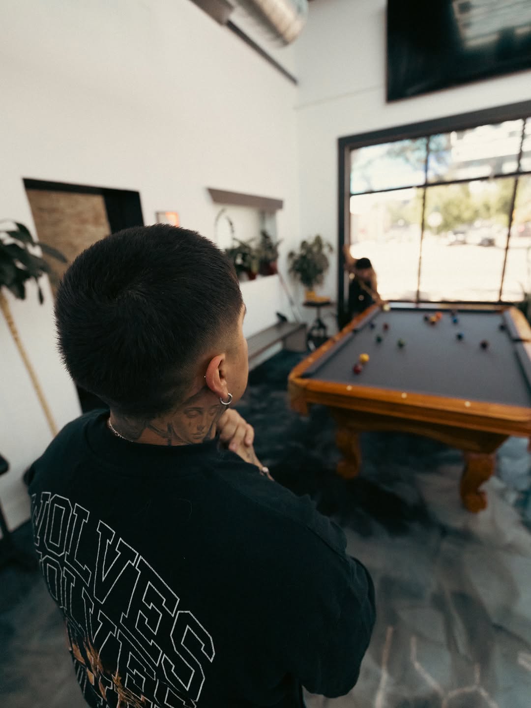 Client receiving tattoo service at Broadway Dept in Sacramento