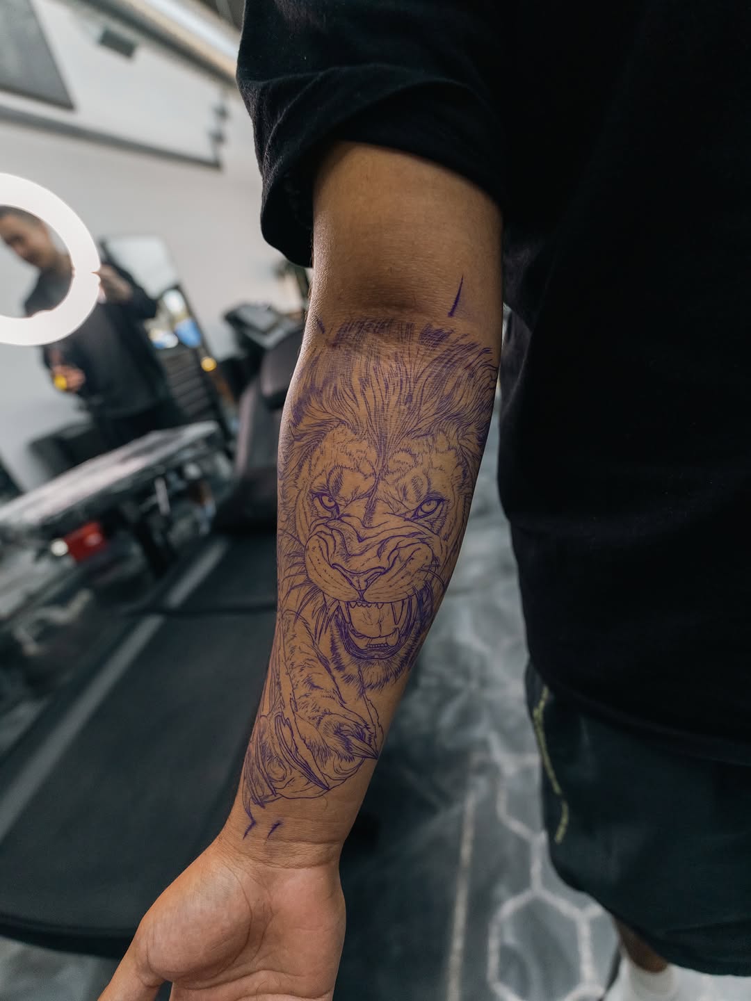 Tattoo artist working on client piece at Broadway Dept. Midtown Sacramento