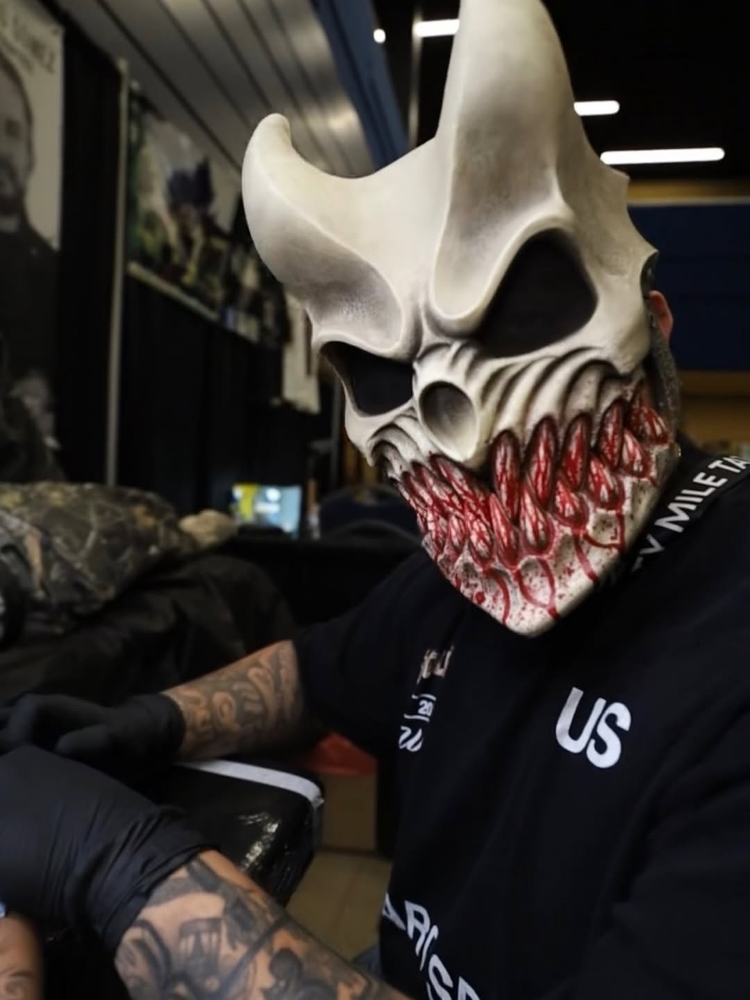 Professional tattoo application at Forty Mile Tattoo Convention in Sacramento