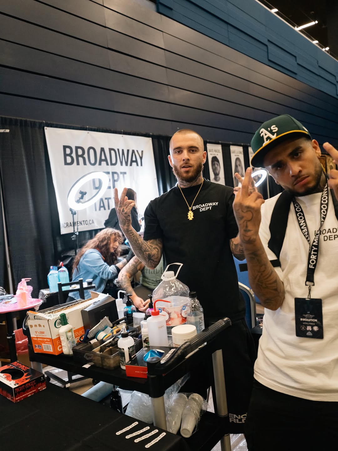 Tattoo convention scene with Broadway Dept team at Forty Mile event