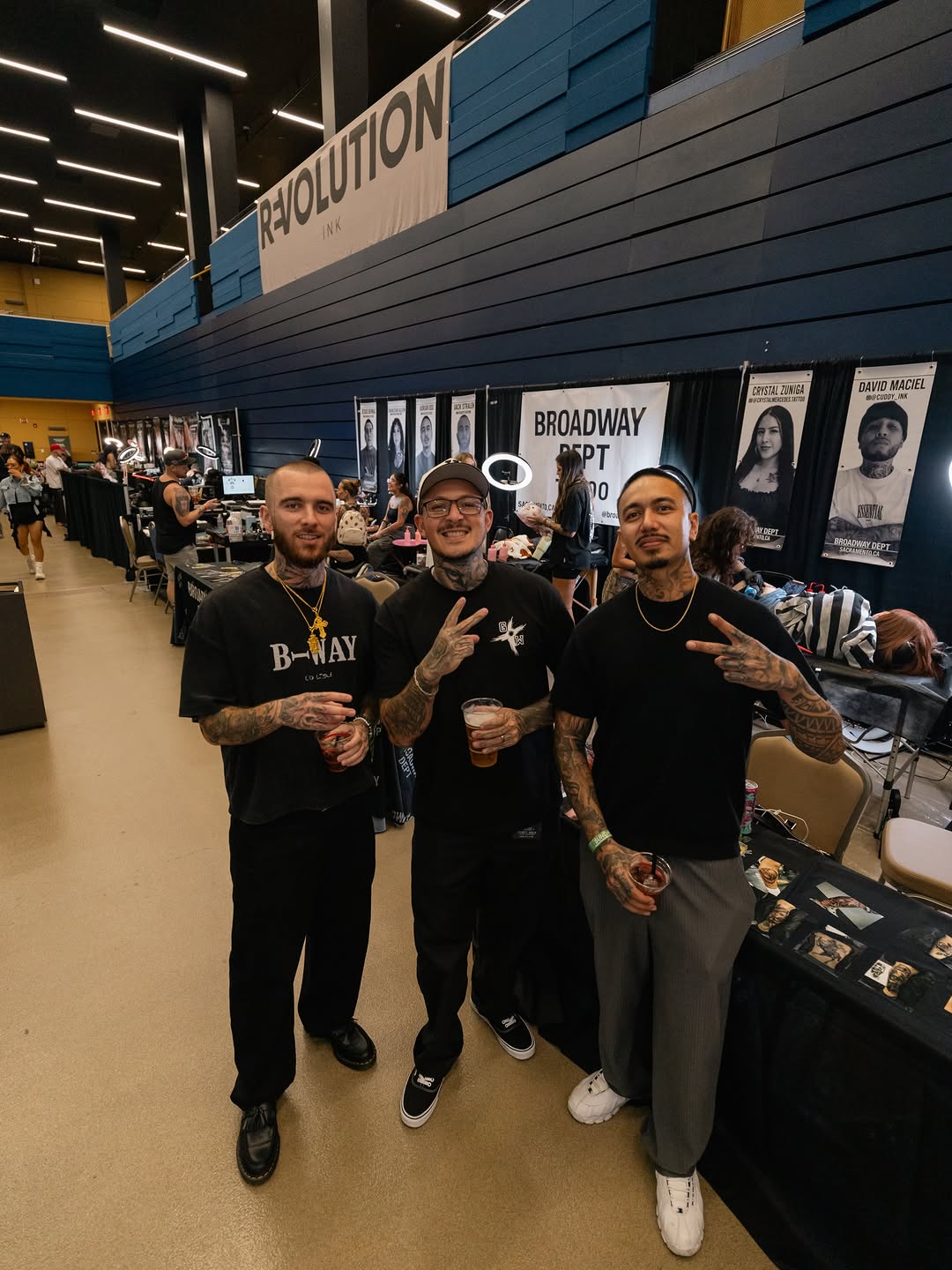 Convention crowd and tattoo artists at Forty Mile event