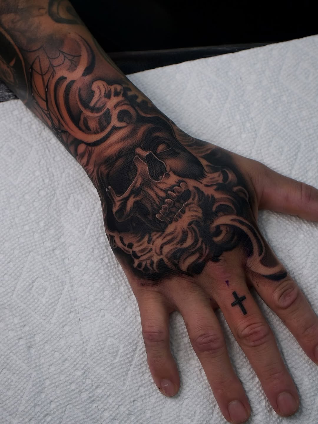 Hand Tattoo Half Skull Half Sculpture by Bella Gomez at Broadway Dept. Sacramento