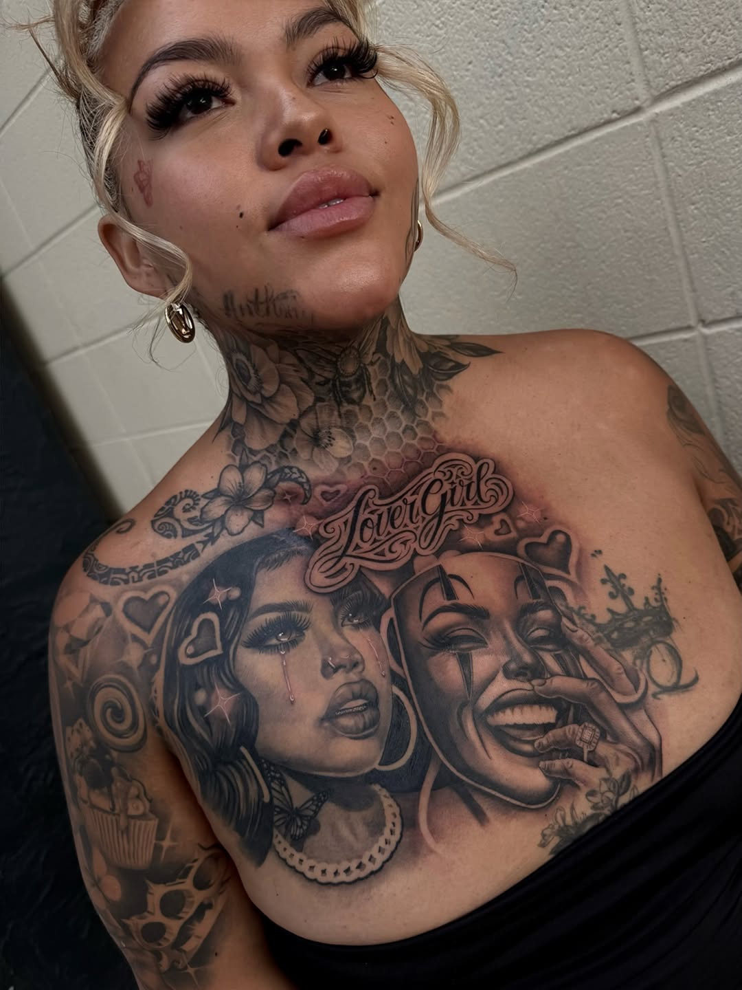Close-up of custom smile now cry later design extending to neck by Bella Gomez