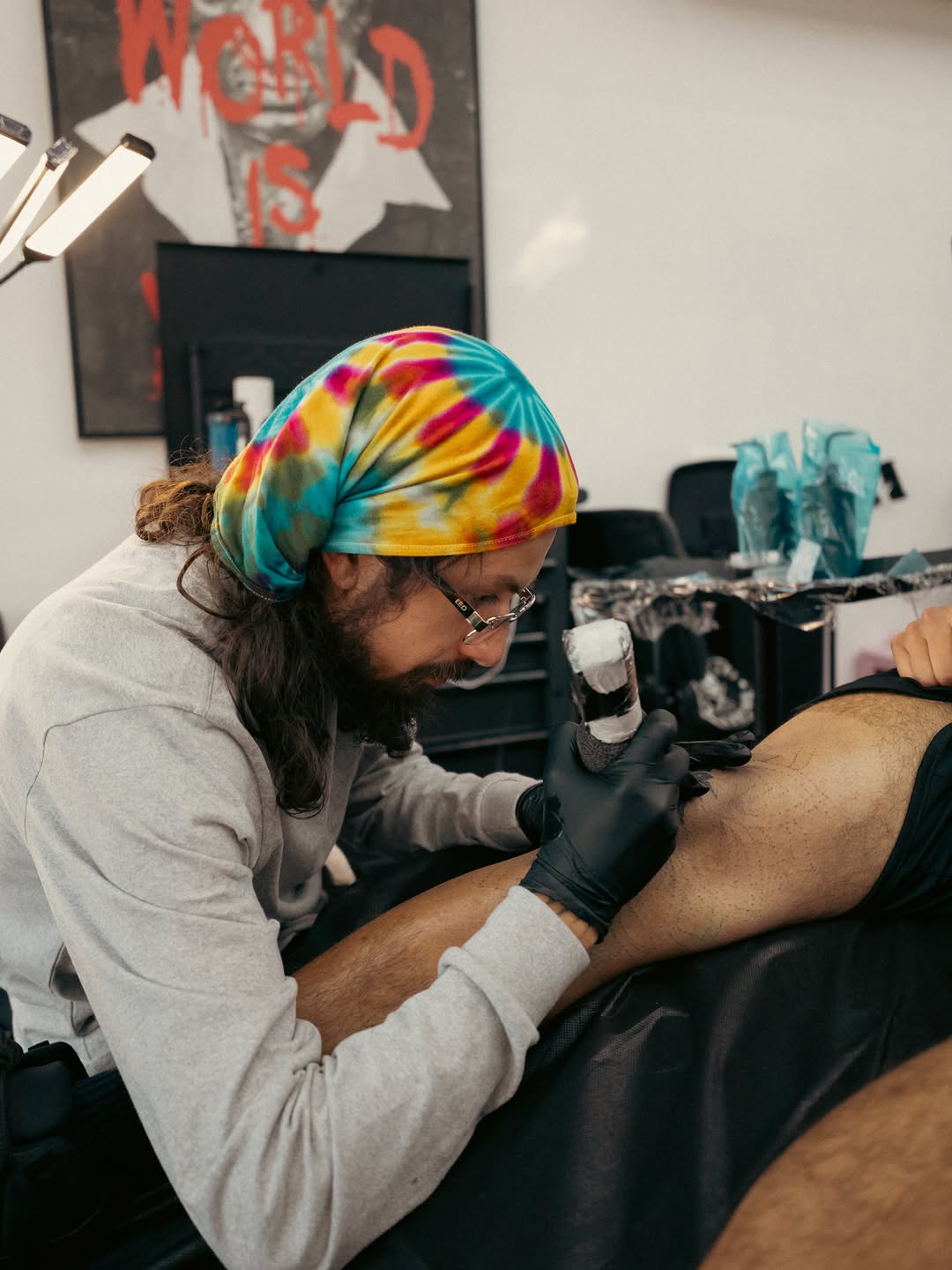Artist concentration during tattoo session at Broadway Dept Sacramento