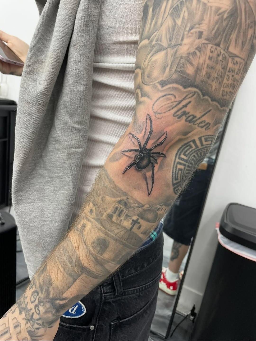 Black and gray spider tattoo by David Maciel at Broadway Dept.